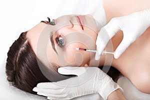 Beautiful woman gets injections. Cosmetology. Beauty Face