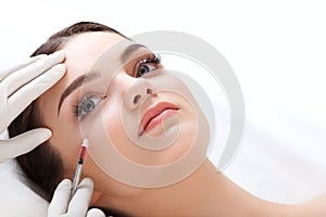 Beautiful woman gets injections. Cosmetology. Beauty Face