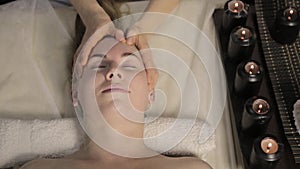 Beautiful woman getting facial massage in spa. facial skin care in beauty saloon.