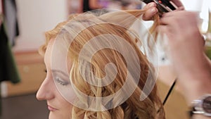 Beautiful woman getting her hair done in the barbershop.