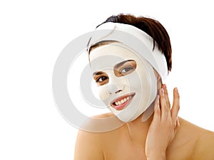 Beautiful Woman Getting Spa Treatment. Cosmetic Mask on Face.