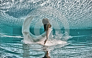 Beautiful woman girl dress underwater diving swim blue sunny day pool