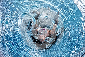 Beautiful woman girl white dress underwater diving swim blue sunny day pool