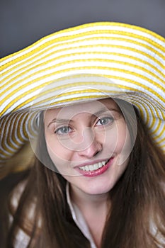 Beautiful woman/girl with yellow hat making faces