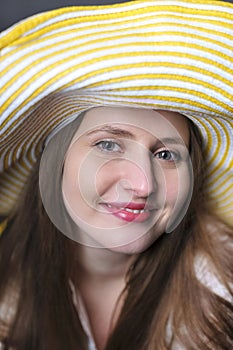 Beautiful woman/girl with yellow hat making faces