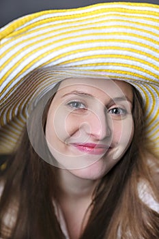 Beautiful woman/girl with yellow hat making faces