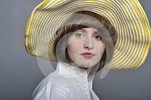 Beautiful woman/girl with yellow hat making faces