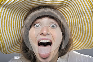 Beautiful woman/girl with yellow hat making faces
