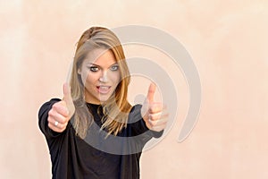 Beautiful woman giving a double thumbs up