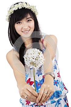 Beautiful woman giving a flower isolated