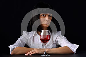Beautiful woman with a glass of red wine