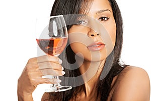 Beautiful woman with glass of rose wine