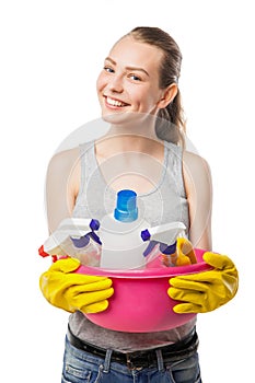 Beautiful woman in gloves with basin over white