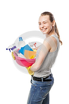 Beautiful woman in gloves with basin over white