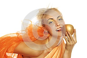 Beautiful woman in gold with gold apple