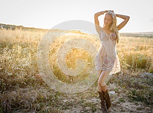 A beautiful woman in golden hay field 3