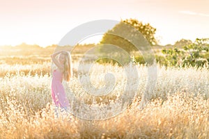 A beautiful woman in golden hay field 6