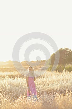 A beautiful woman in golden hay field 5