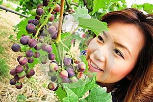 Beautiful woman with grape