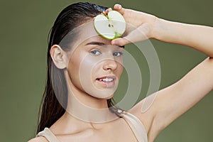 beautiful woman green apple near face health Green background