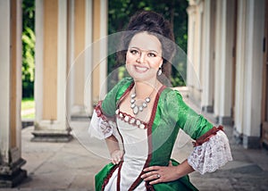 Beautiful woman in green medieval dress