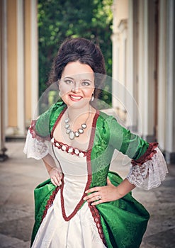 Beautiful woman in green medieval dress