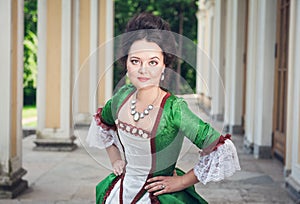 Beautiful woman in green medieval dress