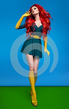 Beautiful woman in green superhero costume