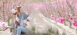 Beautiful woman in a grove of fruit trees in Cieza in the Murcia