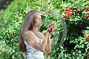Beautiful woman with guelder rose photo