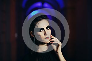 Beautiful woman with Halloween makeup. Close up street night portrait. Toned