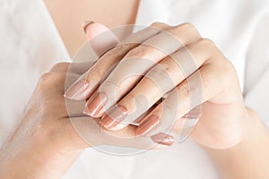 Beautiful woman hand and nail polish closeup