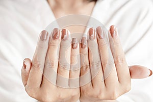Beautiful woman hand and nail polish closeup