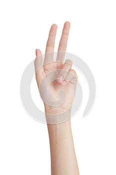 Beautiful woman hand on a white background gesture of two fingers up. isolate