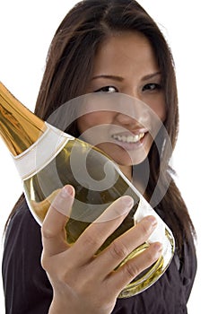 Beautiful woman handling Champagne bottle