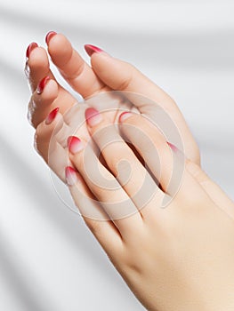 Beautiful Woman Hands. Female Hands Applying Cream, Lotion. Spa and Manicure concept. Female hands with french