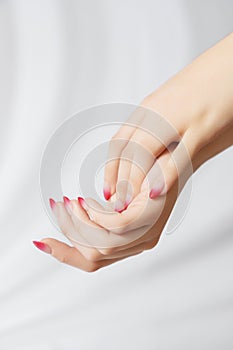 Beautiful Woman Hands. Female Hands Applying Cream, Lotion. Spa and Manicure concept. Female hands with french