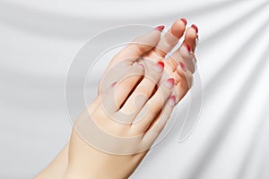 Beautiful Woman Hands. Female Hands Applying Cream, Lotion. Spa and Manicure concept. Female hands with french