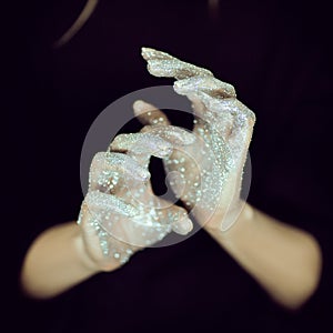 Beautiful woman hands with glister, glitter or fairy dust