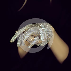 Beautiful woman hands with glister, glitter or fairy dust