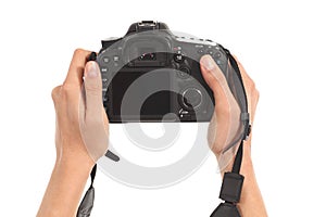 Beautiful woman hands holding a dslr camera photo