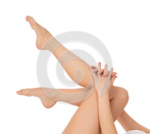 Beautiful woman hands and legs with french manicured nails isolated on a white background