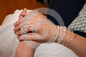 Beautiful woman hands with manicure holding in luxury jewelry concept