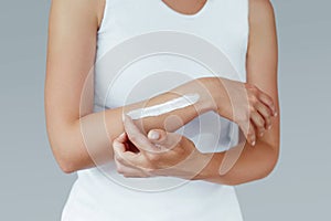 Beautiful Woman Hands With Natural Manicure Nails Applying Cosmetic Hand Cream On Soft Silky Healthy Skin.