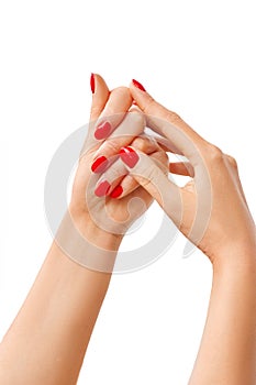 Beautiful woman hands with red manicure isolated on white background