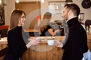 Beautiful Woman And Handsome Man Drinking Coffee While Spending Time In Coffee Shop.