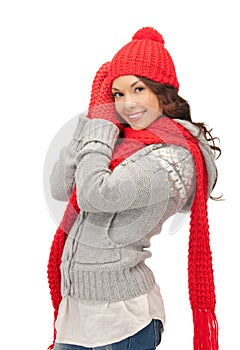 Beautiful woman in hat, muffler and mittens