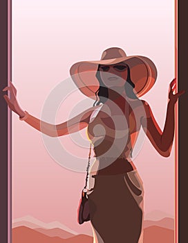 Beautiful woman in a hat in pink light