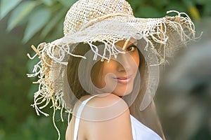 Beautiful woman in hat summer day outdoors. Fashion and lifestyle concept.