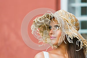 Beautiful woman in hat summer day outdoors. Fashion and lifestyle concept